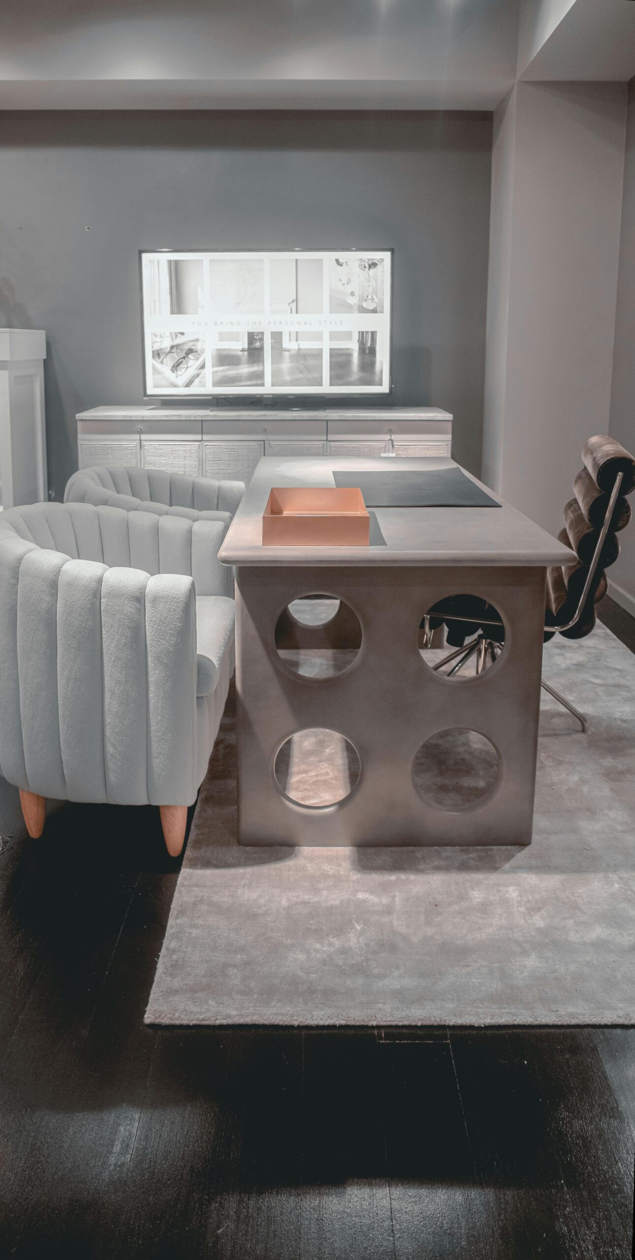 Sleek modern office interior featuring stylish armchair and desk with unique design.